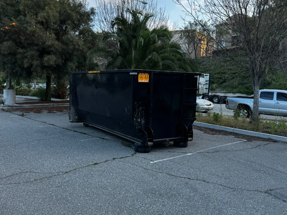 Park N Dump 20 yard dumpster in a parking lot